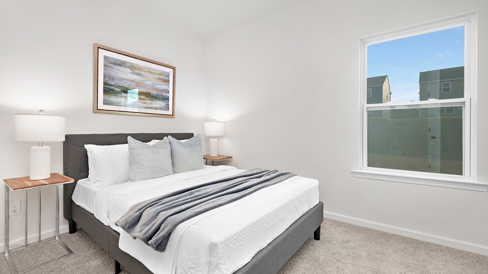 Carpeted bedroom with large window