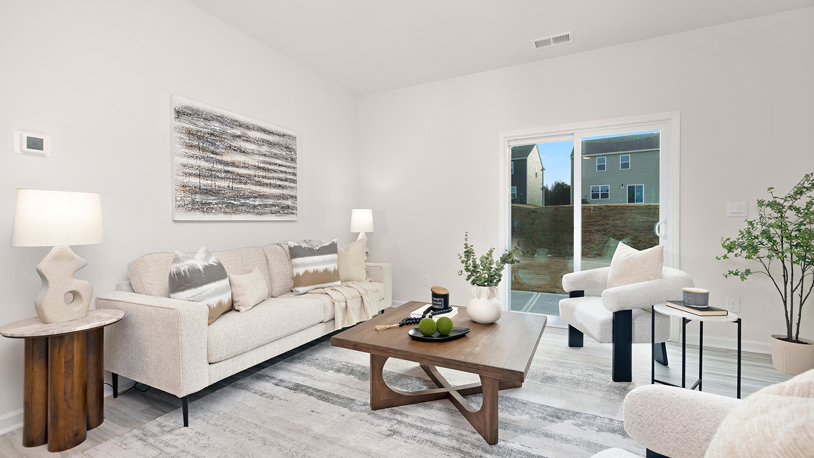Family room with fireplace and large window