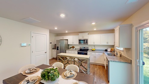 Kitchen and dining area with sliding glass back door