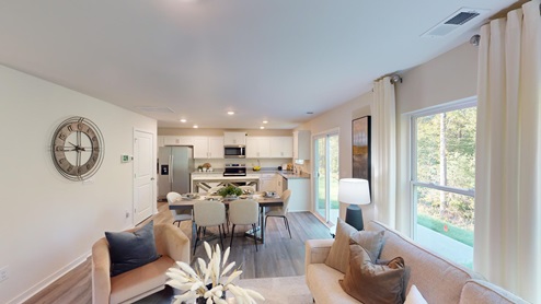 Dining area and living room beside kitchen