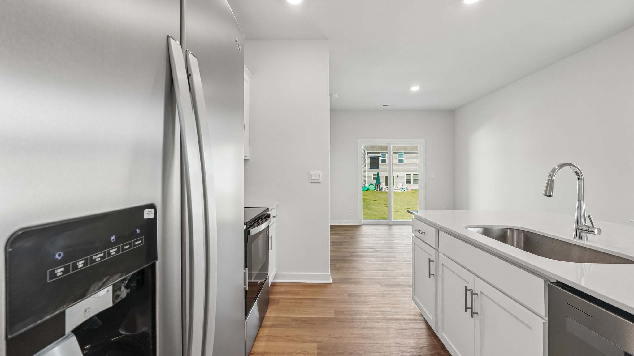 Kitchen and island with white cabinets