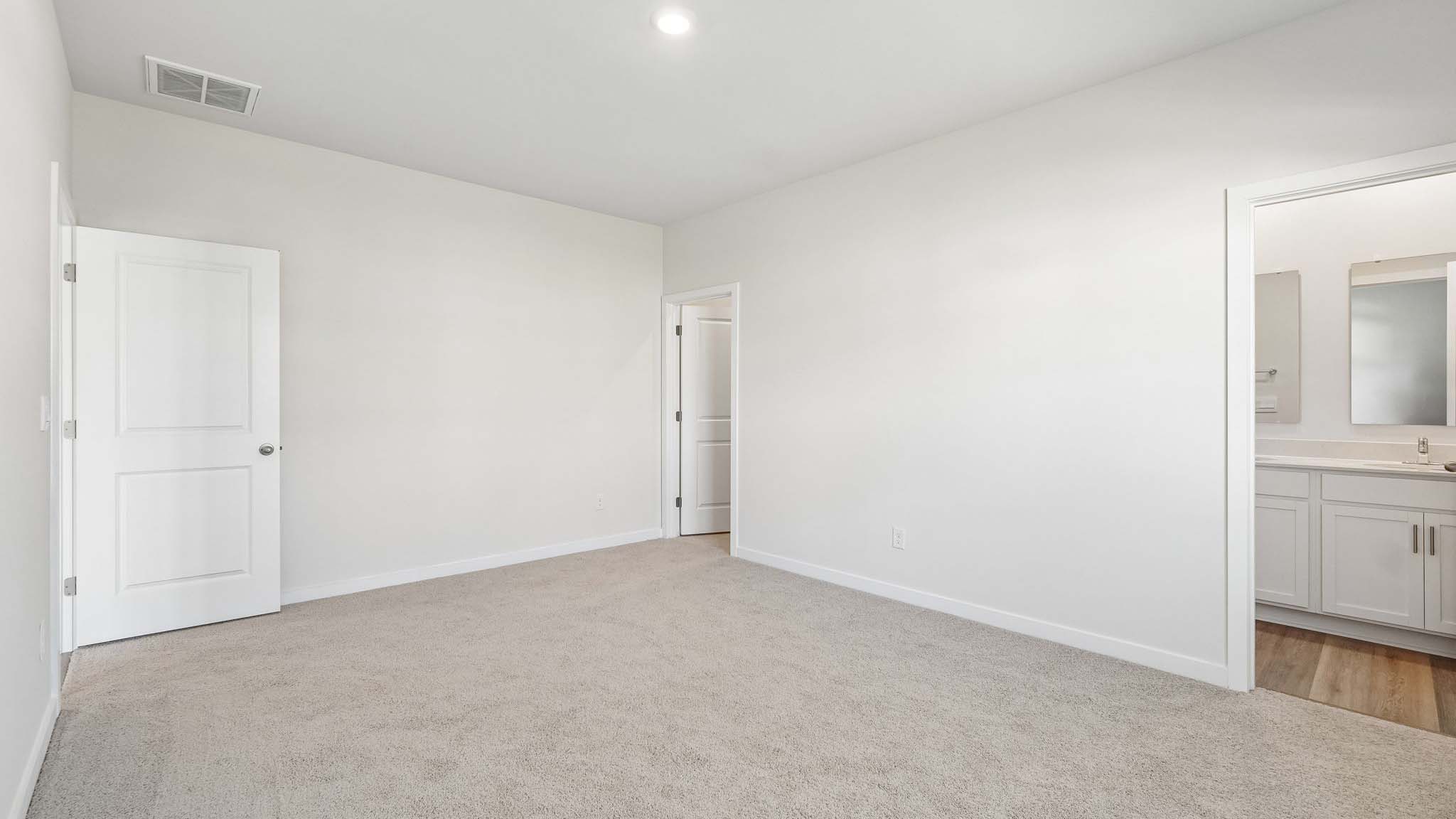 Carpeted bedroom with window