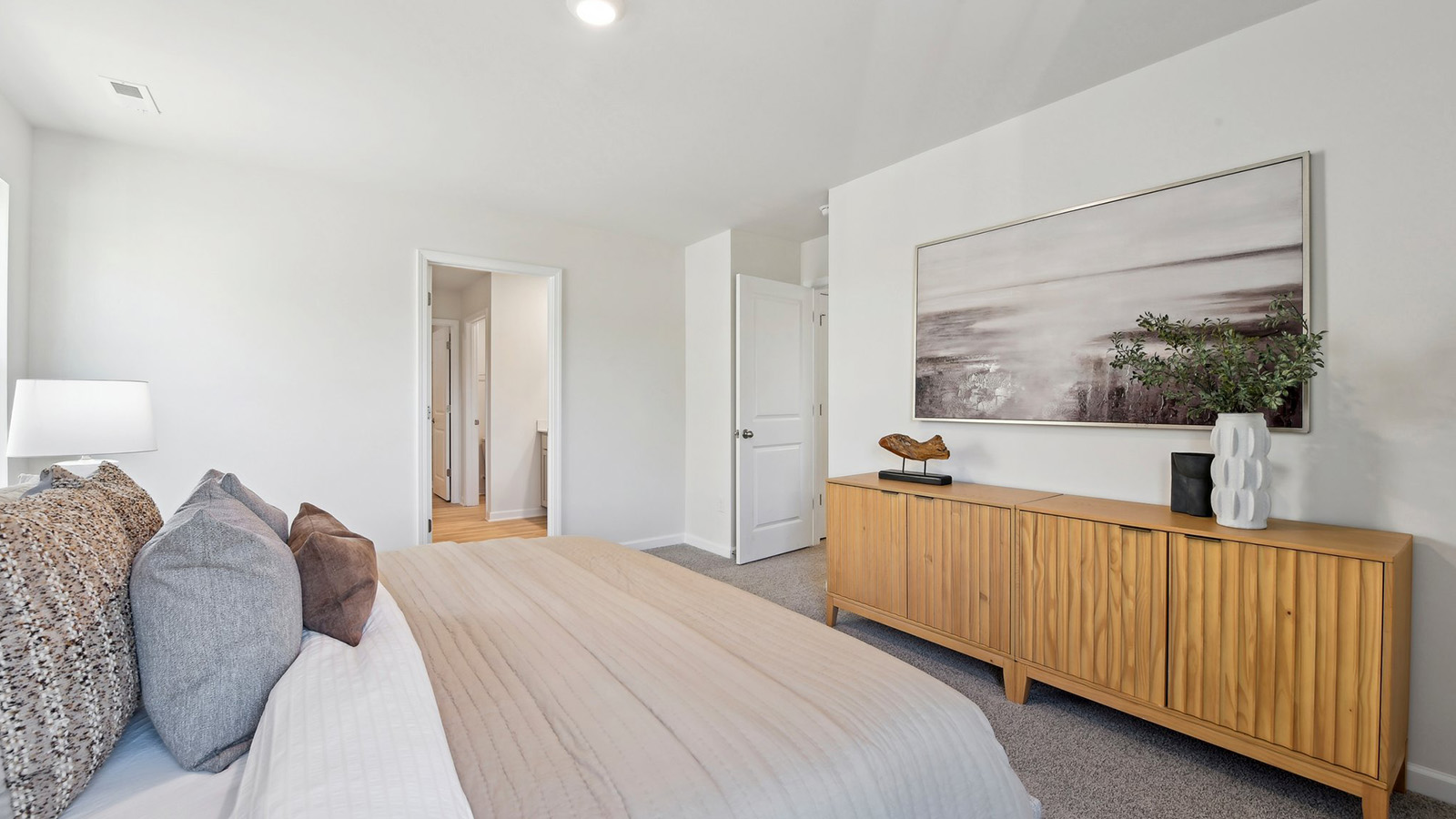 Primary bedroom, carpeted with large windows