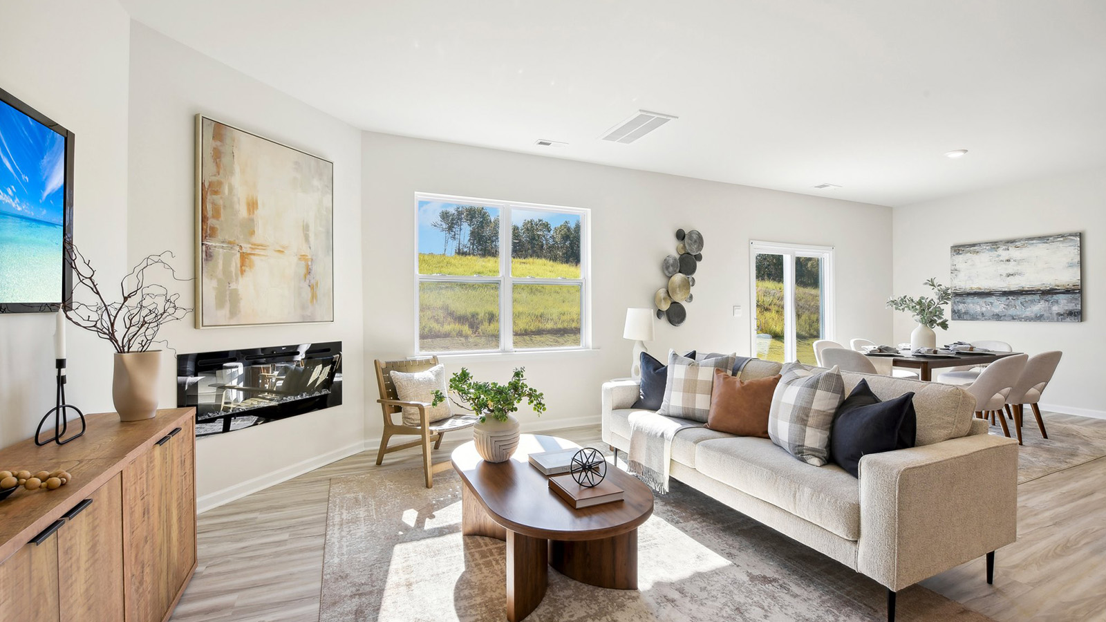 Spacious family room with large windows and fireplace