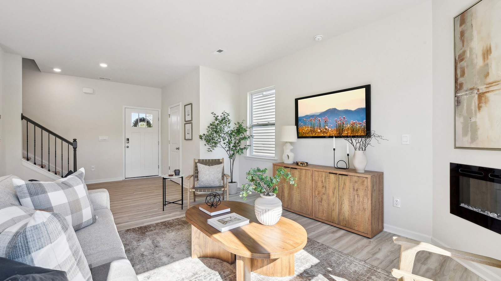 Spacious family room with large windows and fireplace