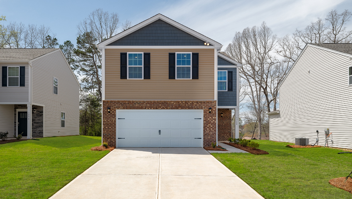 Aisle front exterior with siding and two car garage