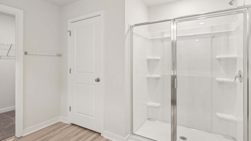 Bathroom with double sink vanity and walk in shower