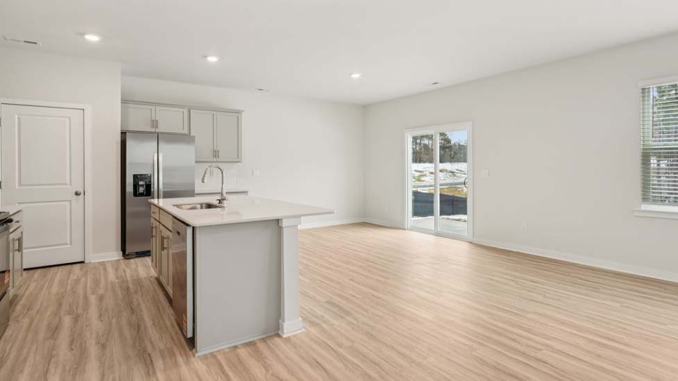 Living room with electric fireplace and large window