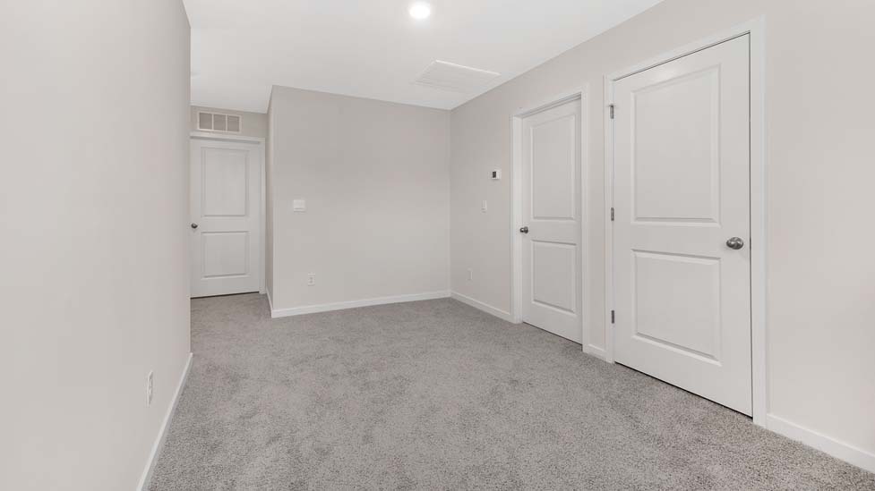 Open flex space, carpeted with large window