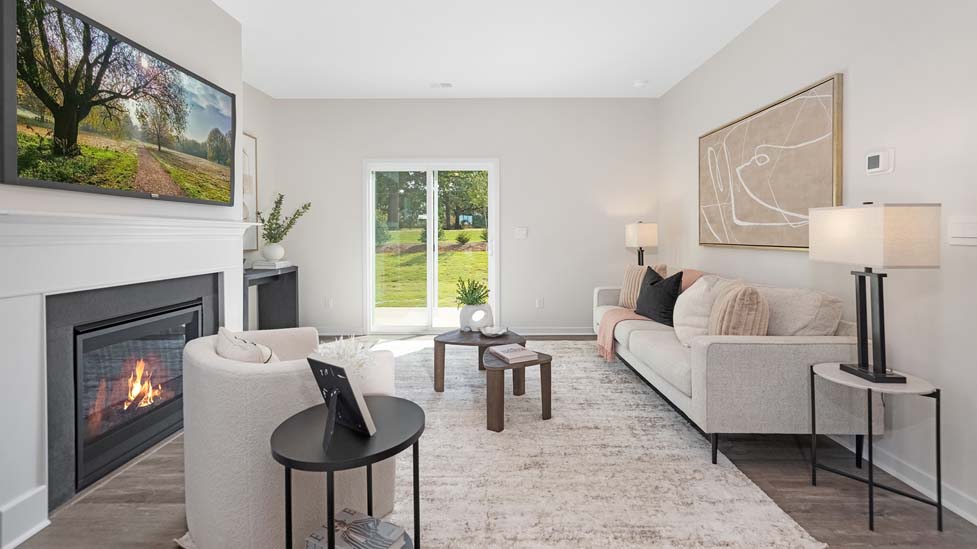Family room with fireplace and large window