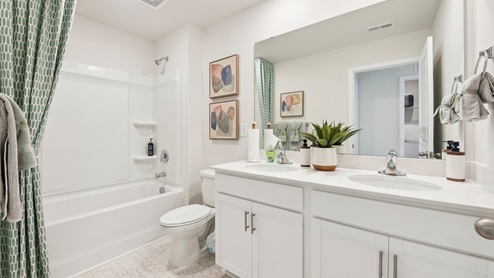 Bathroom with double sink vanity and bathtub and shower combination. New Home in Charlotte, North Carolina