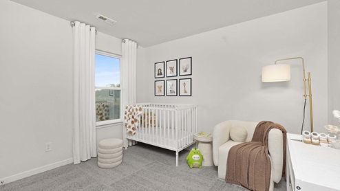 Carpeted bedroom with large windows