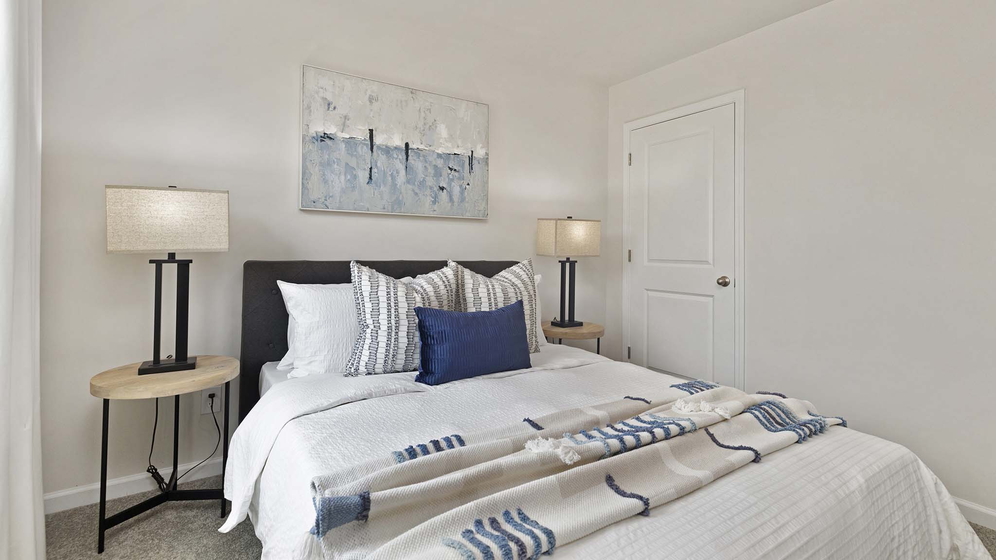 Carpeted bedroom with windows