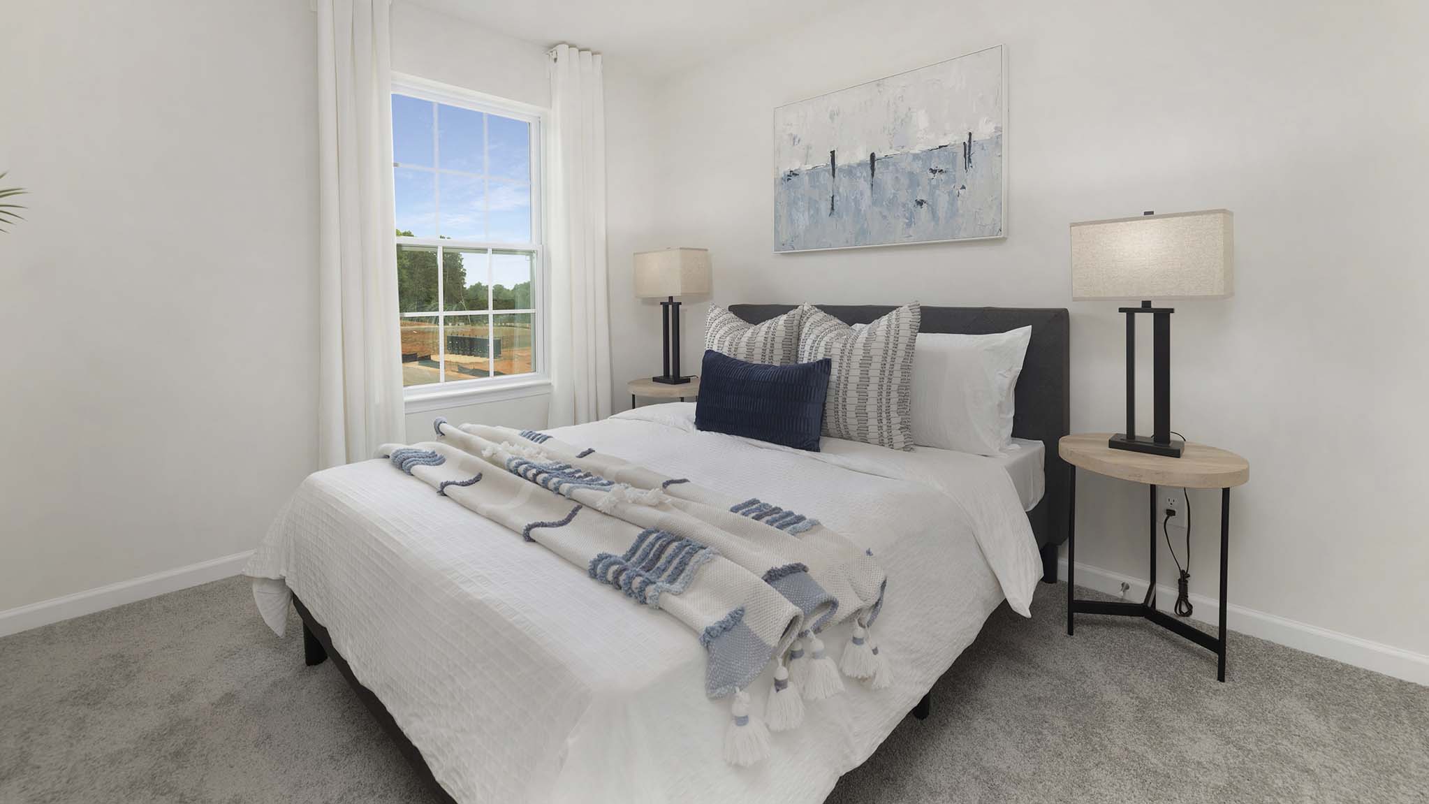 Carpeted bedroom with windows