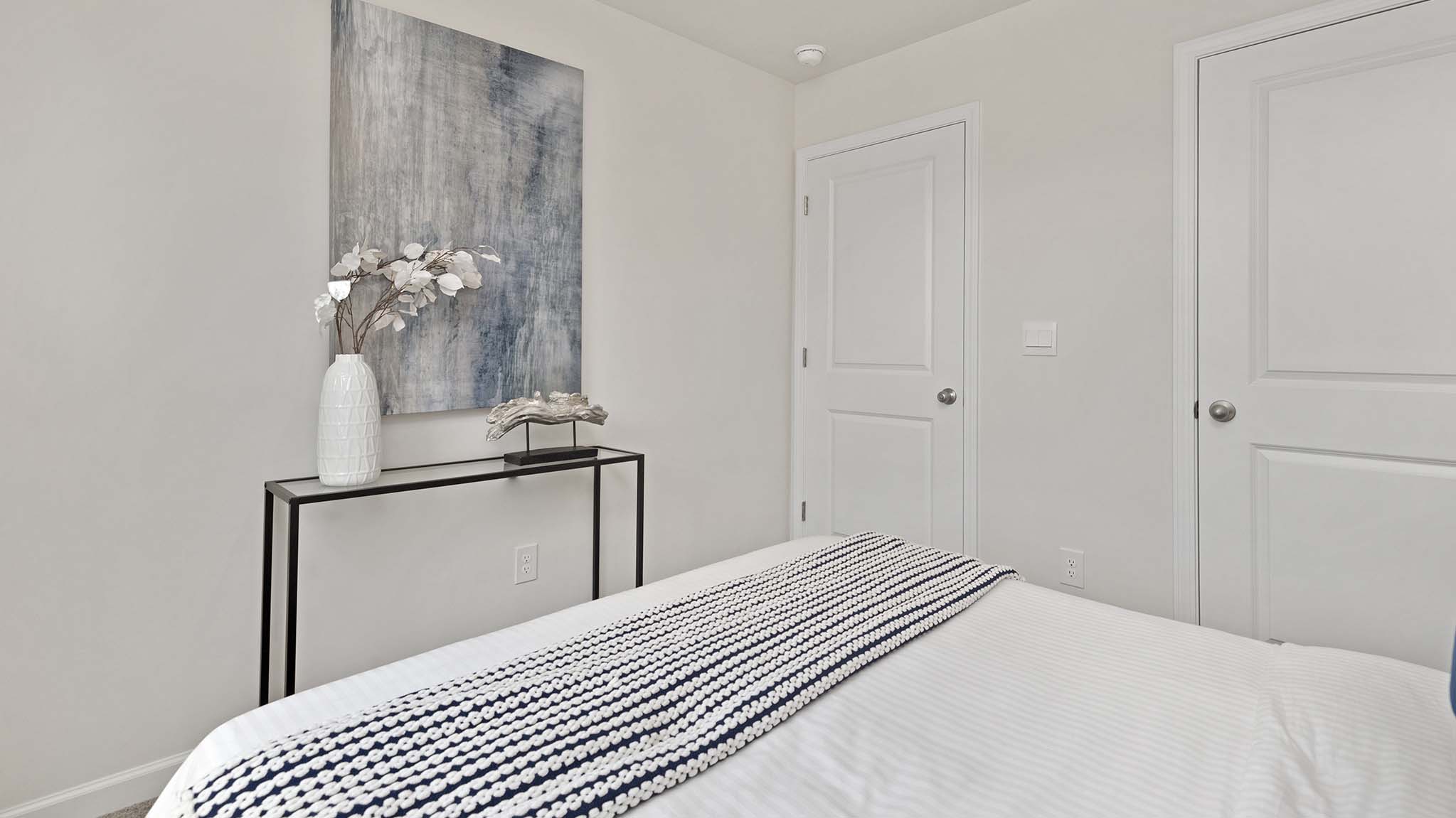 Carpeted bedroom with windows