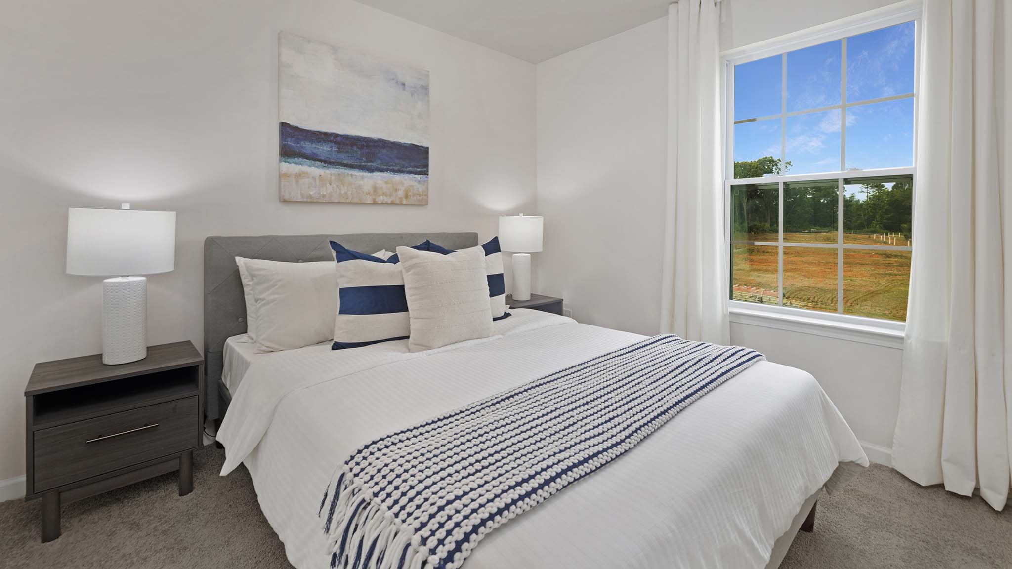 Carpeted bedroom with windows