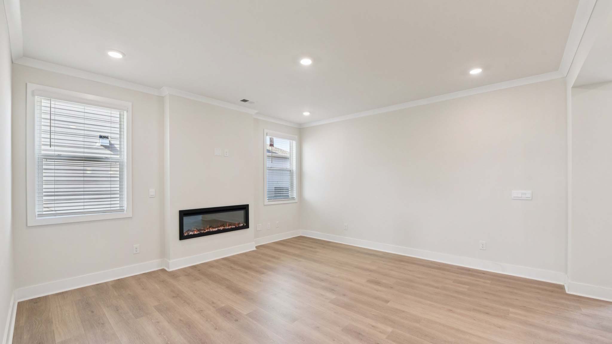 Living room with fireplace and windows