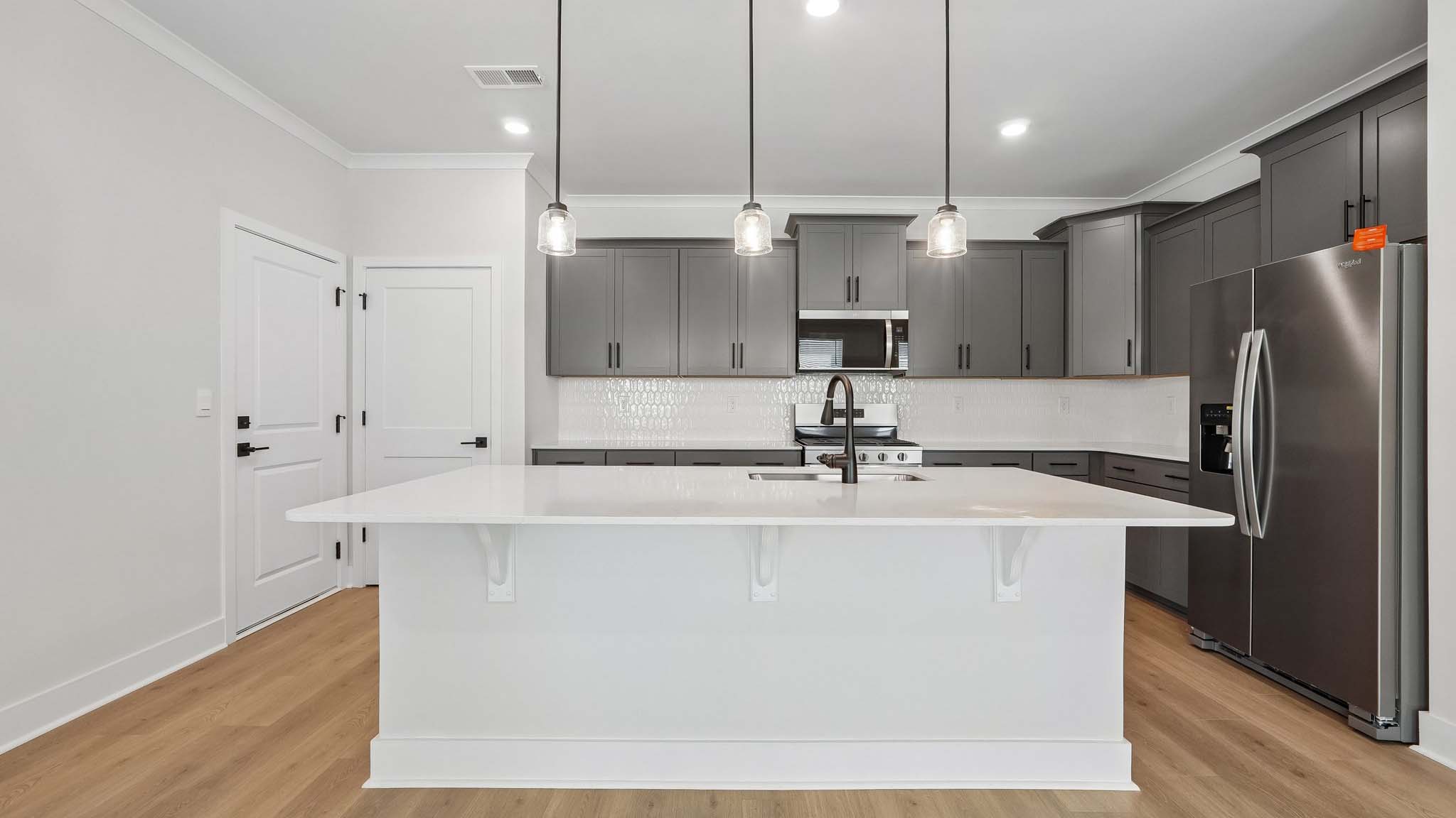 Kitchen and island with quartz countertops