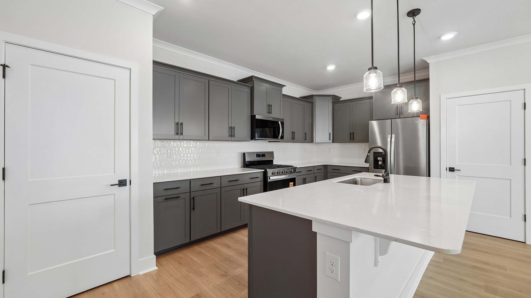 Kitchen and island with quartz countertops