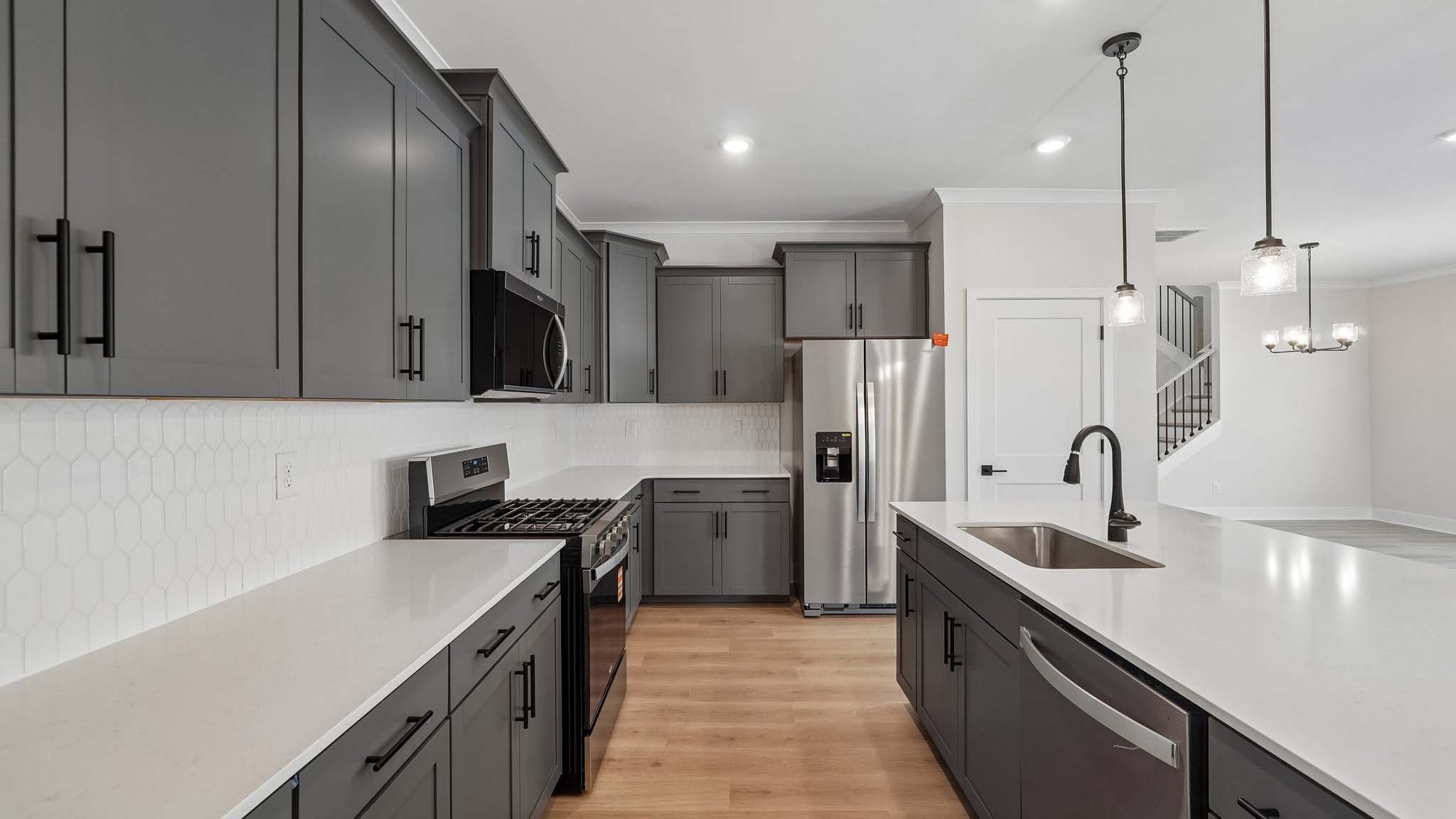 Kitchen and island with quartz countertops