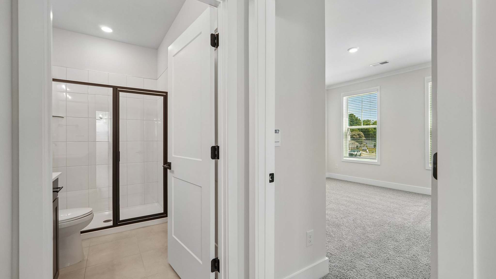 Bathroom with standing glass shower