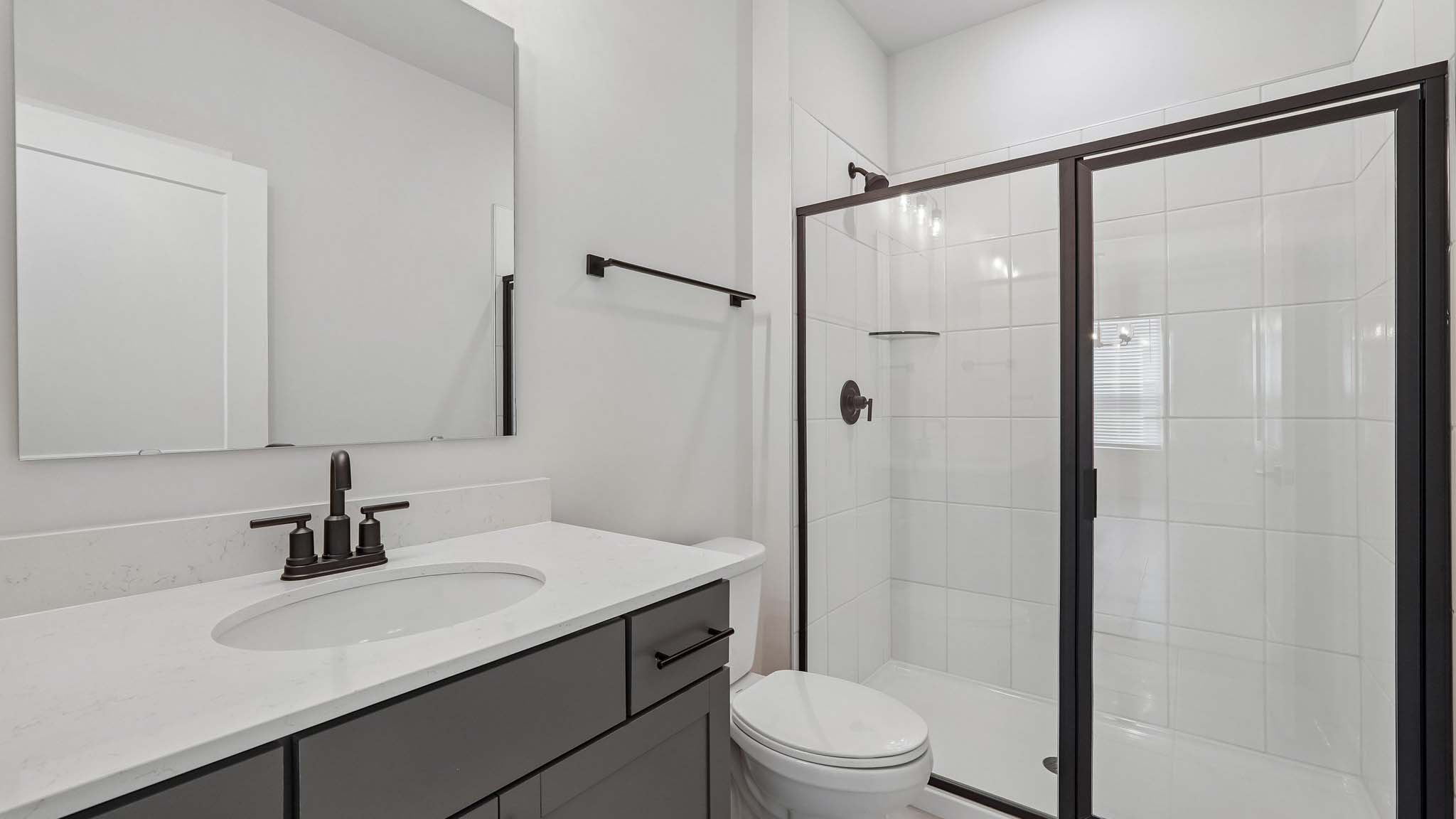 Bathroom with standing glass shower