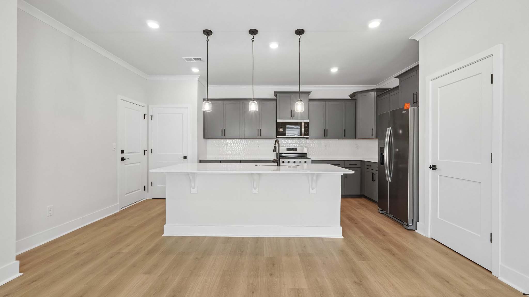 Kitchen and island with quartz countertops