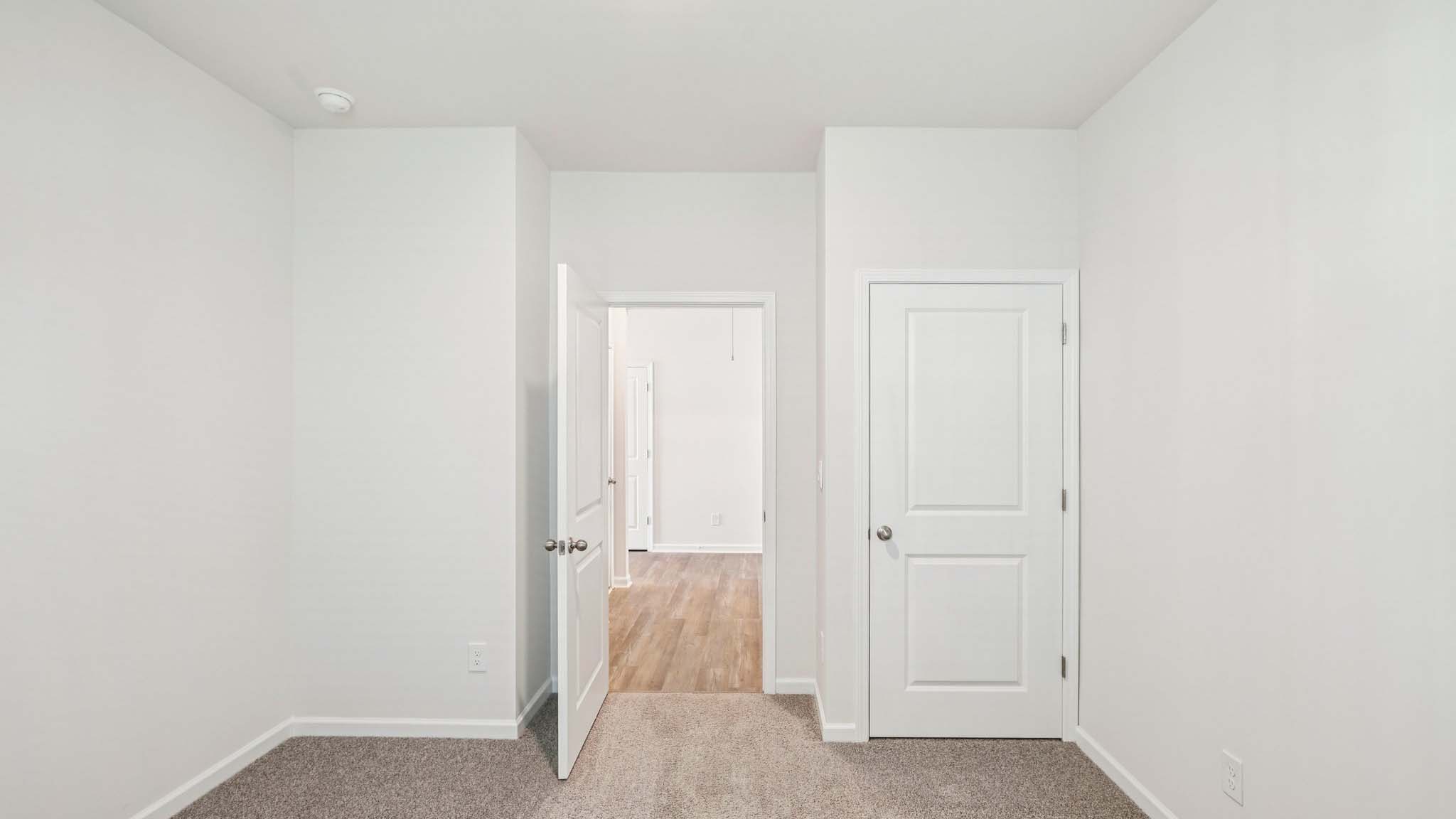 Carpeted bedroom with window