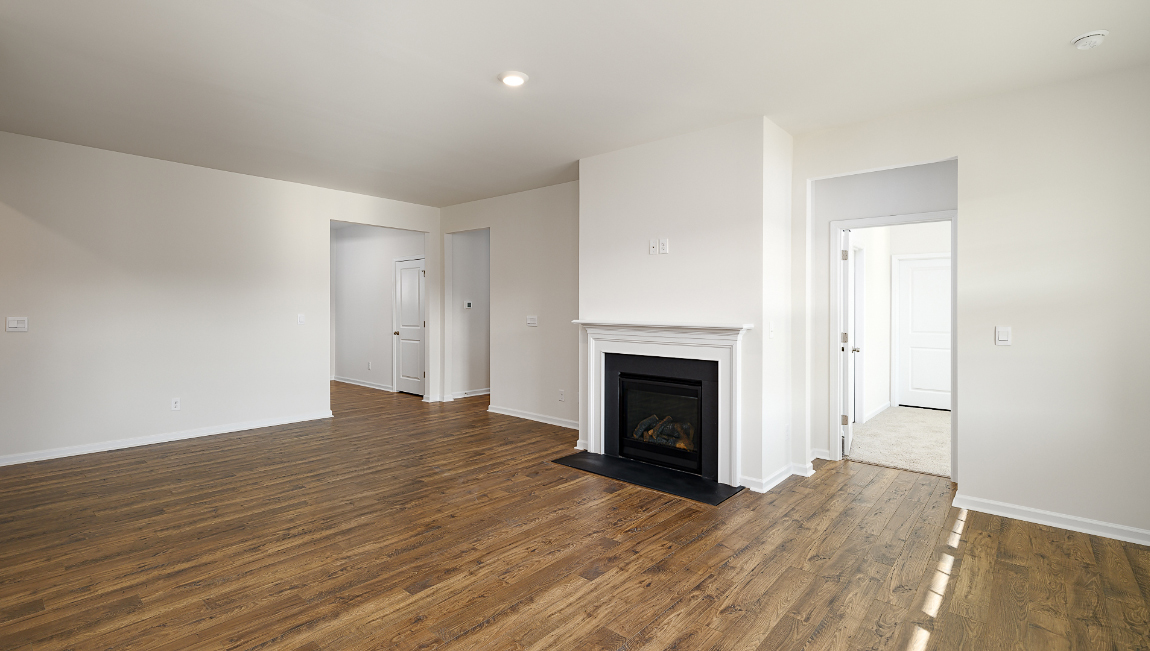 Open family room with large windows, and fireplace