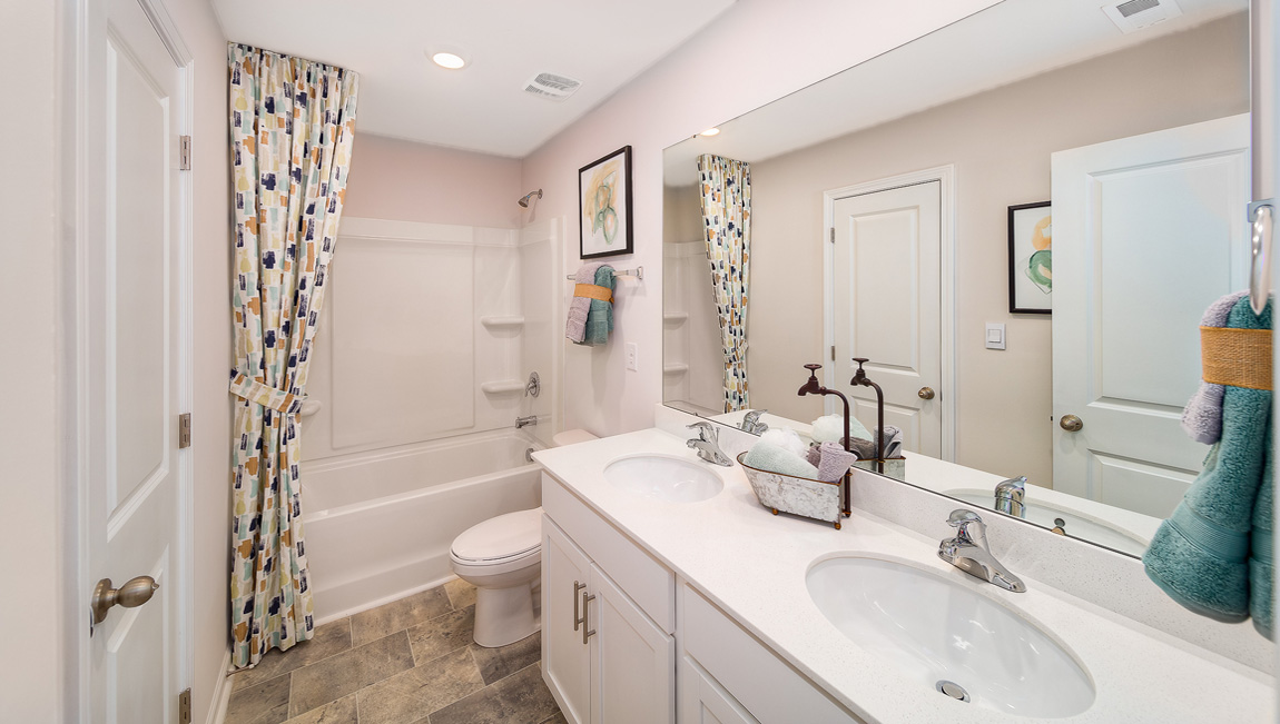 Bathroom with double sinks, and bathtub