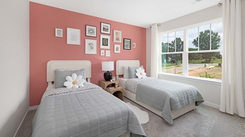 Carpeted bedroom with large windows