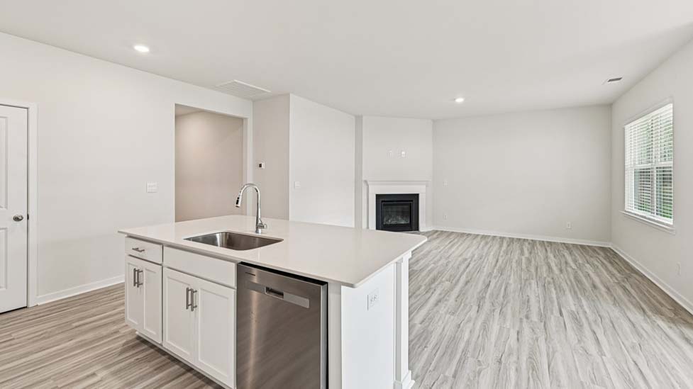 Kitchen and island with stainless steel appliances
