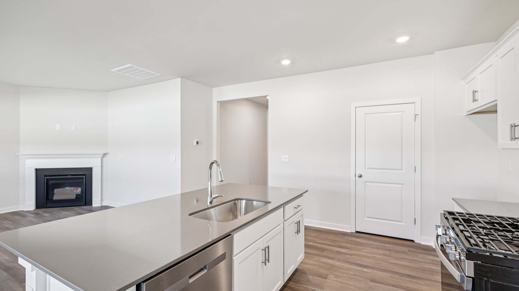 Kitchen and island with stainless steel appliances