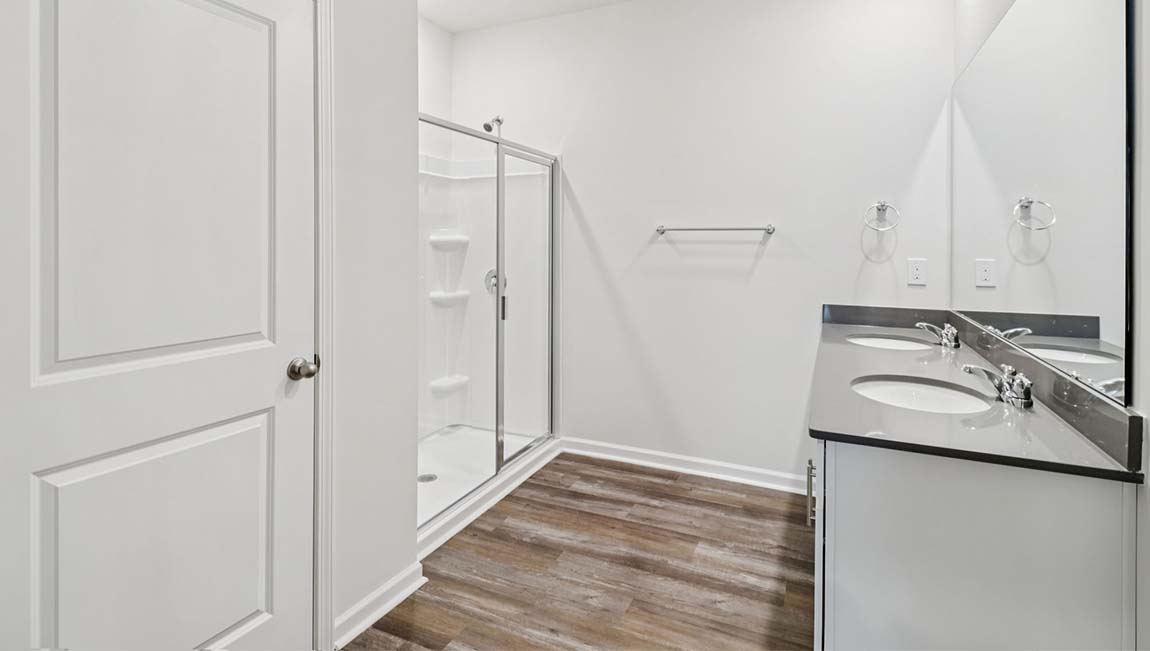 Bathroom with soaking tuyb, wlak in shower, and double sink vanity