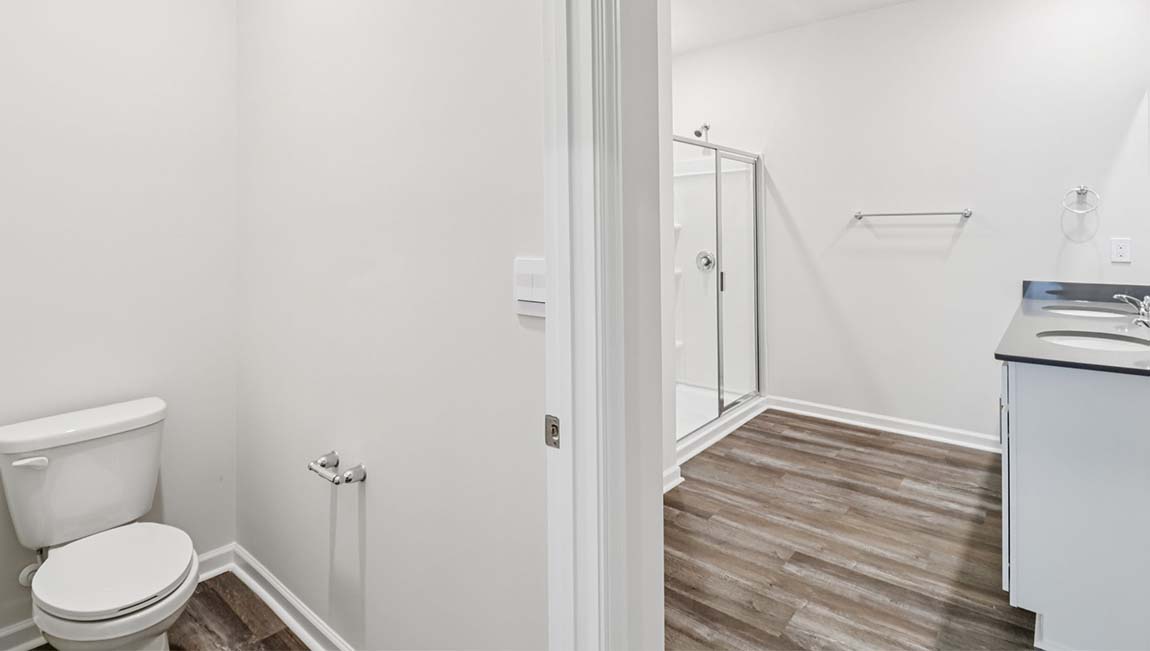 Bathroom with soaking tuyb, wlak in shower, and double sink vanity