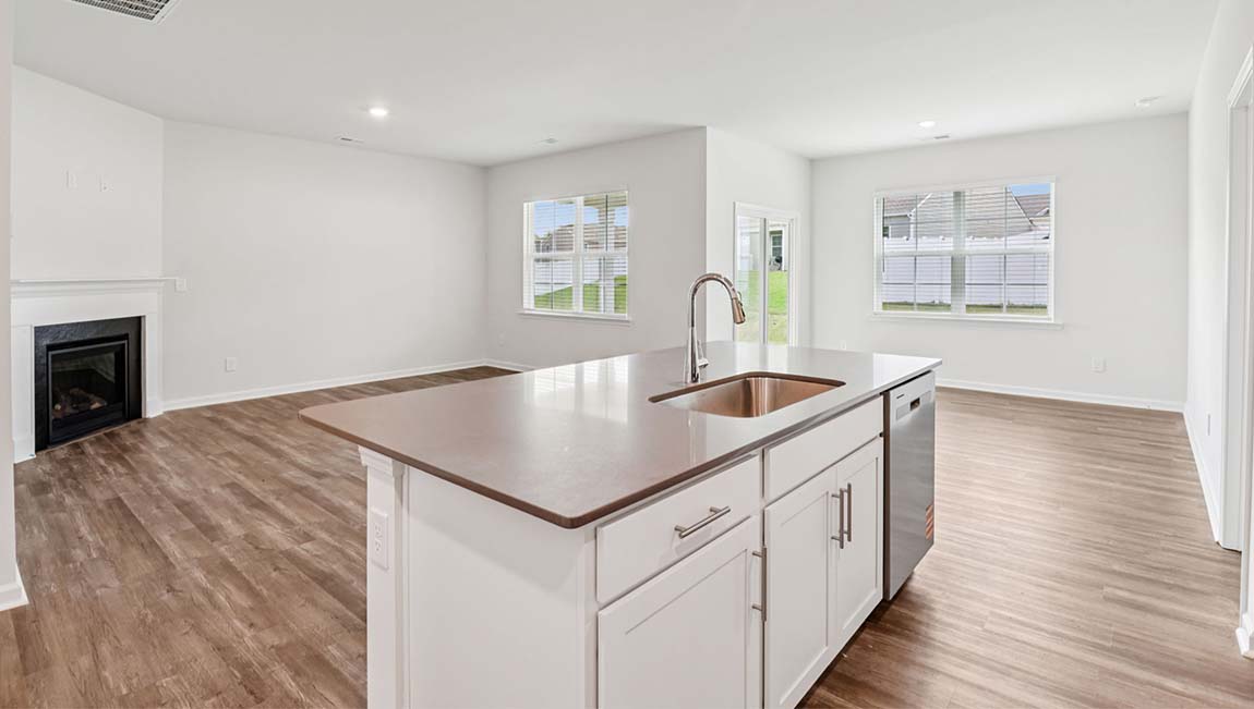 Kitchen and island with stainless steel appliances