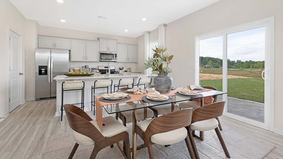 Dining room beside kitchen with sliding glass back door