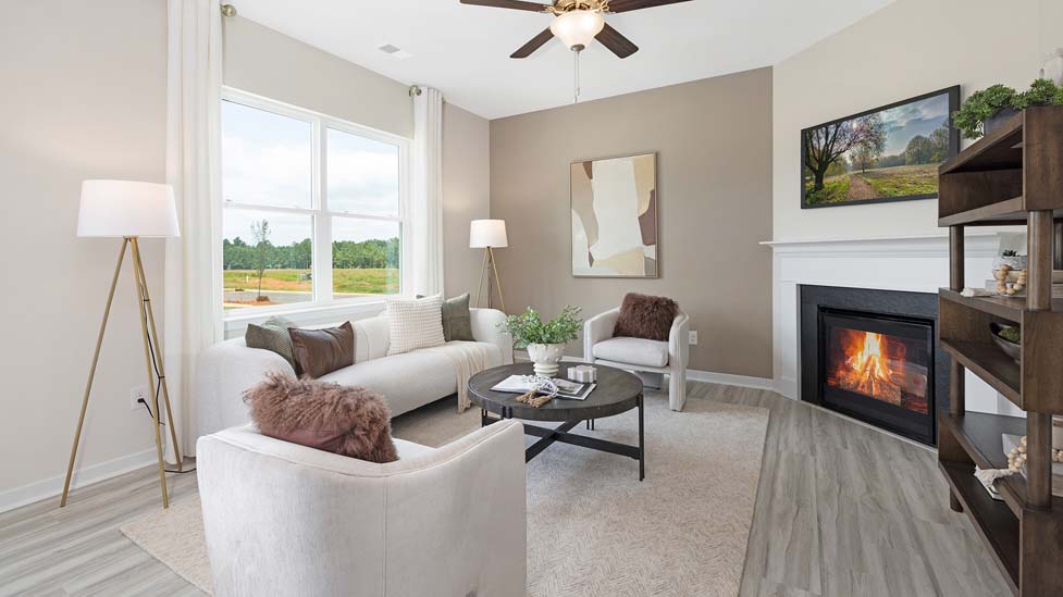 living room with vinyl flooring, electric fireplace and large window