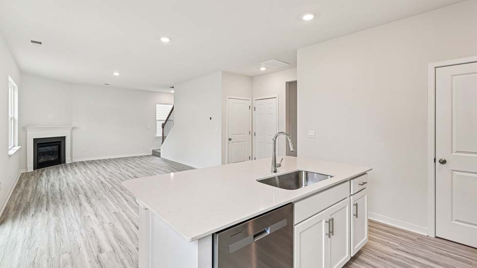 Kitchen and island with stainless steel appliances