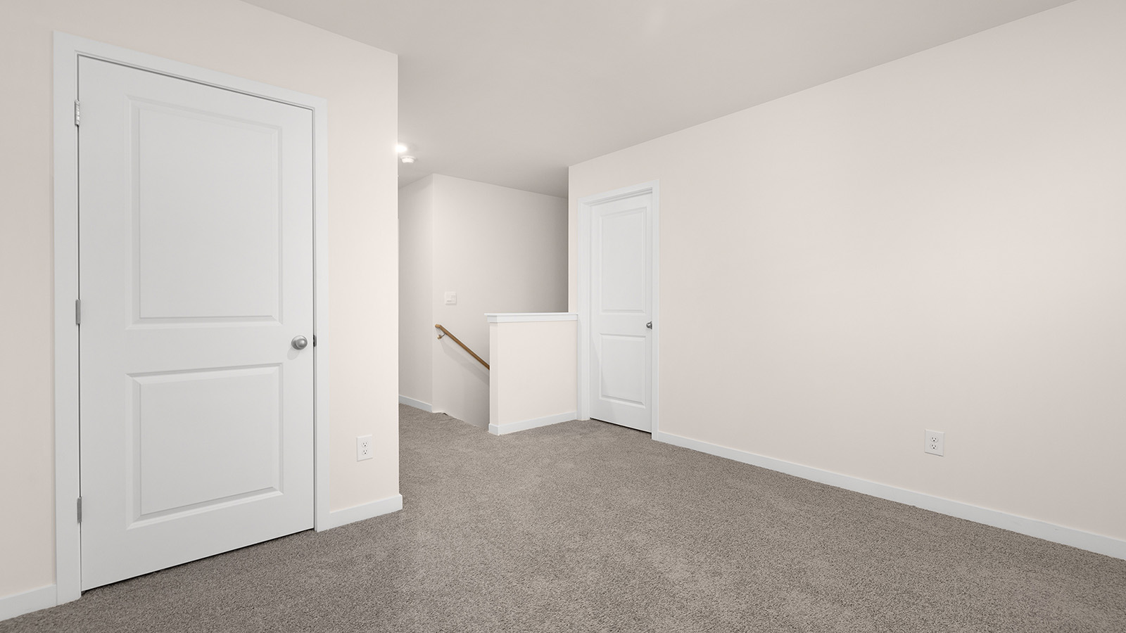 Carpeted bedroom with large windows