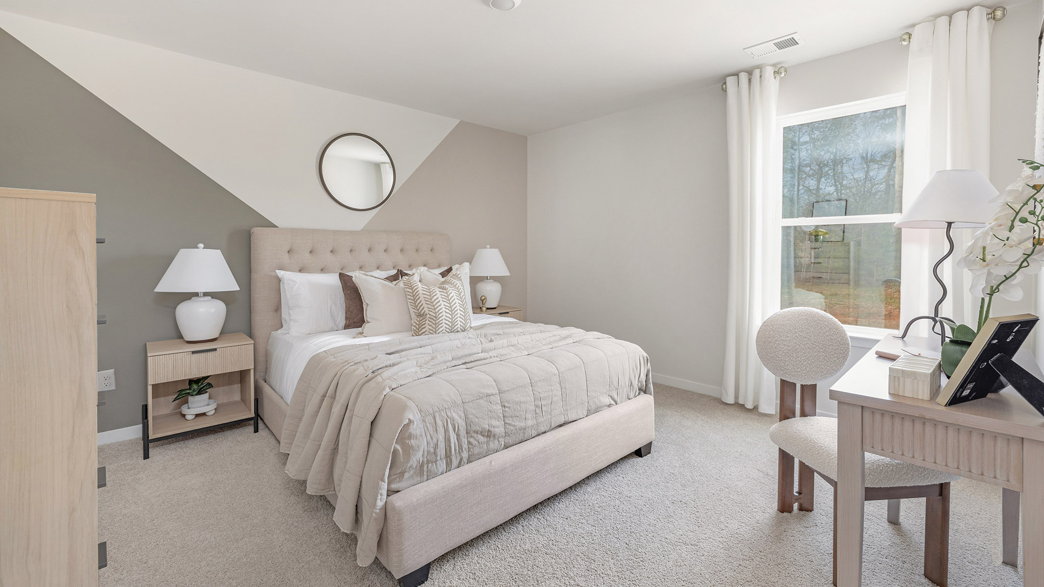 Carpeted bedroom with large windows