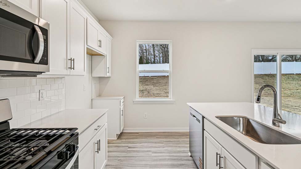 kitchen and island with stainless steel appliances