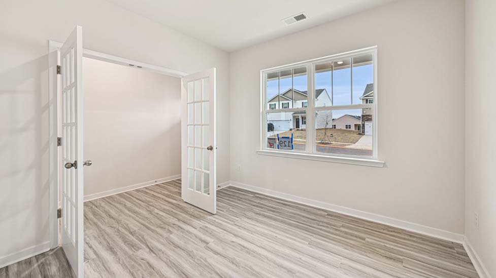 flex room with french doors and large window