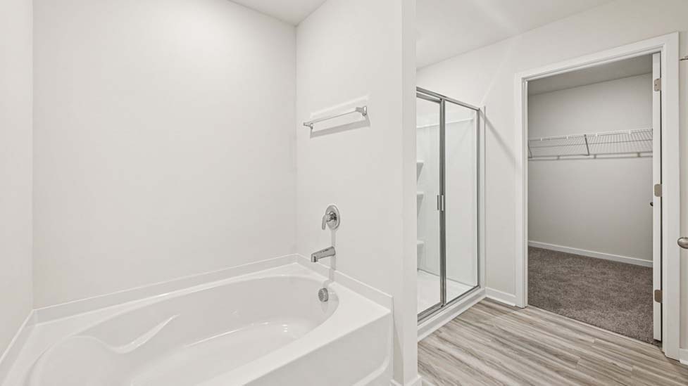 Bathroom with double sink vanity and walk in shower