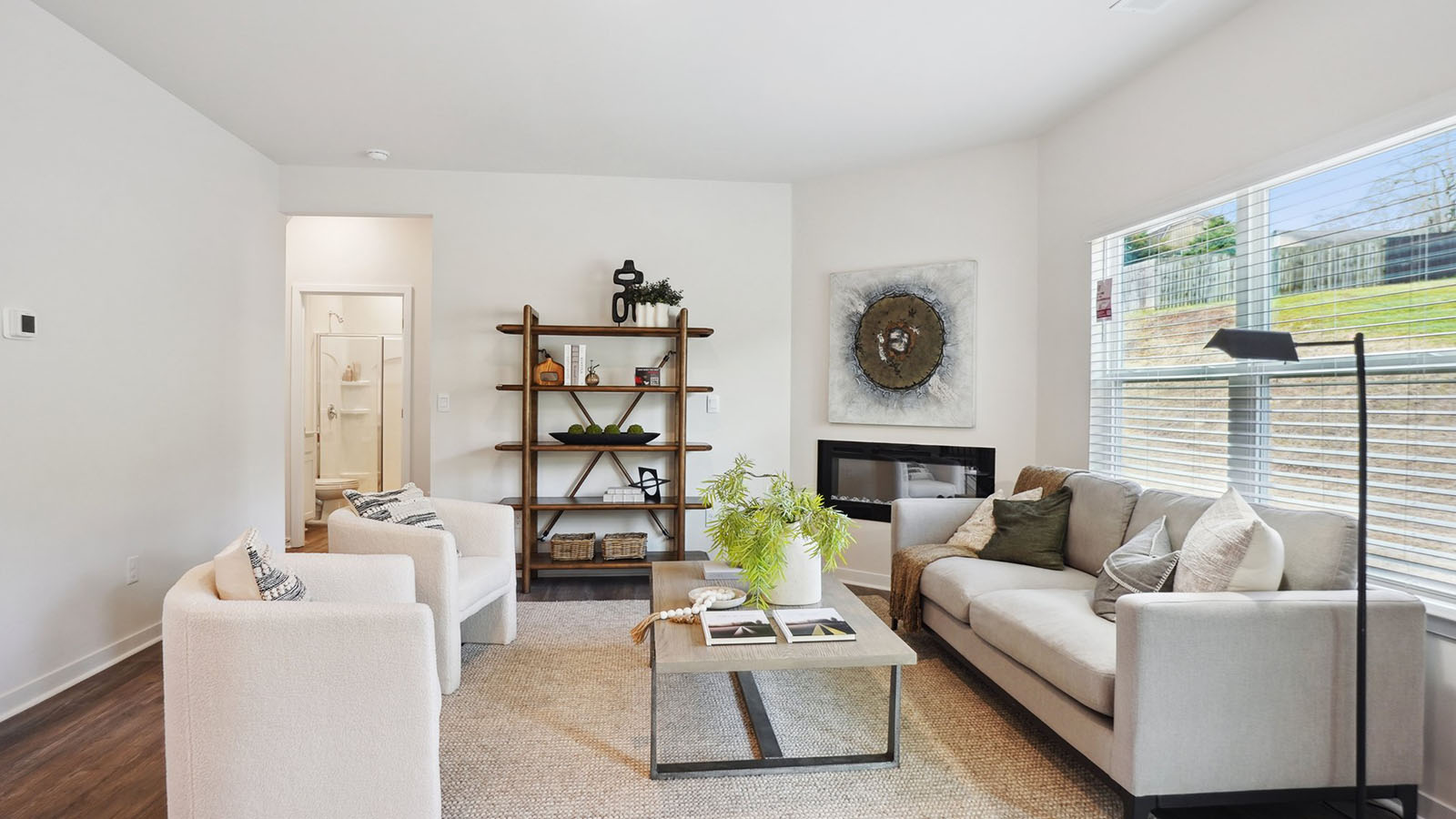 model open family room with windows and fireplace