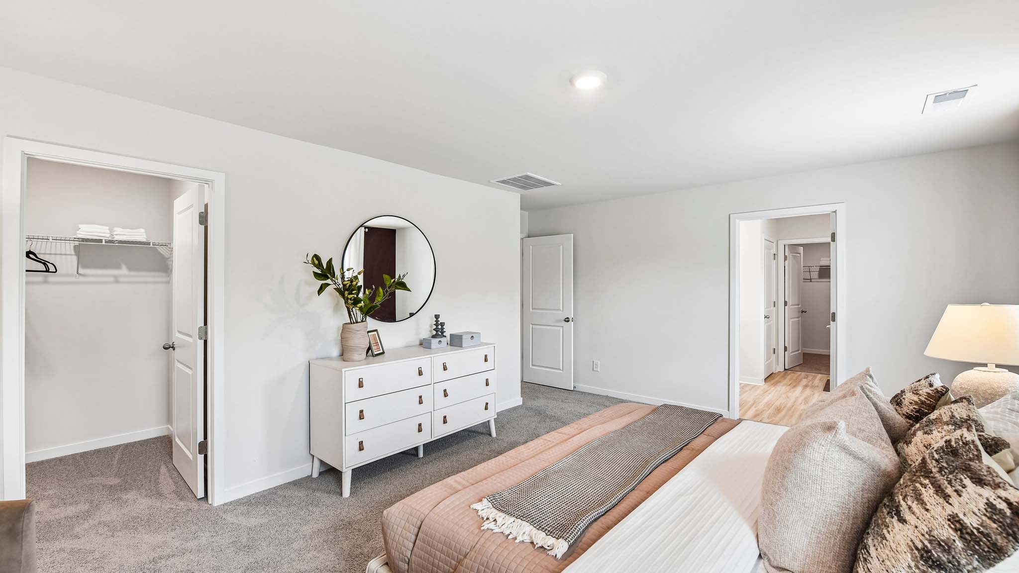 Primary carpeted bedroom