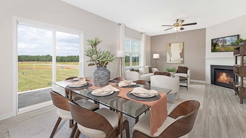 breakfast or dining area beside kitchen and living room with sliding glass back door