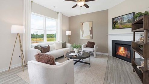 Living room with ceiling fan, and fireplace