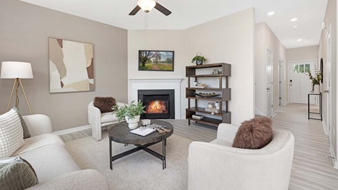 Living room with ceiling fan, and fireplace