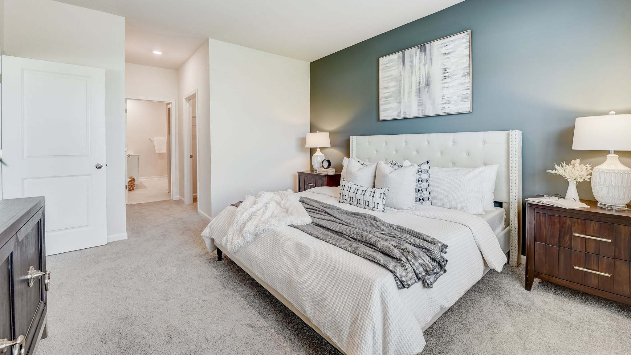 Carpeted bedroom with large window